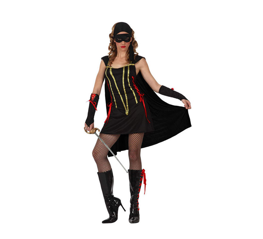 Disfraz de Bandida para mujer. Talla standar M-L 38/42. Incluye vestido con capa, guantes y pañuelo. Espada, botas y medias NO incluidas, podrás verlas en la sección de Complementos. Éste traje es perfecto para vestirse de la mujer del Zorro.